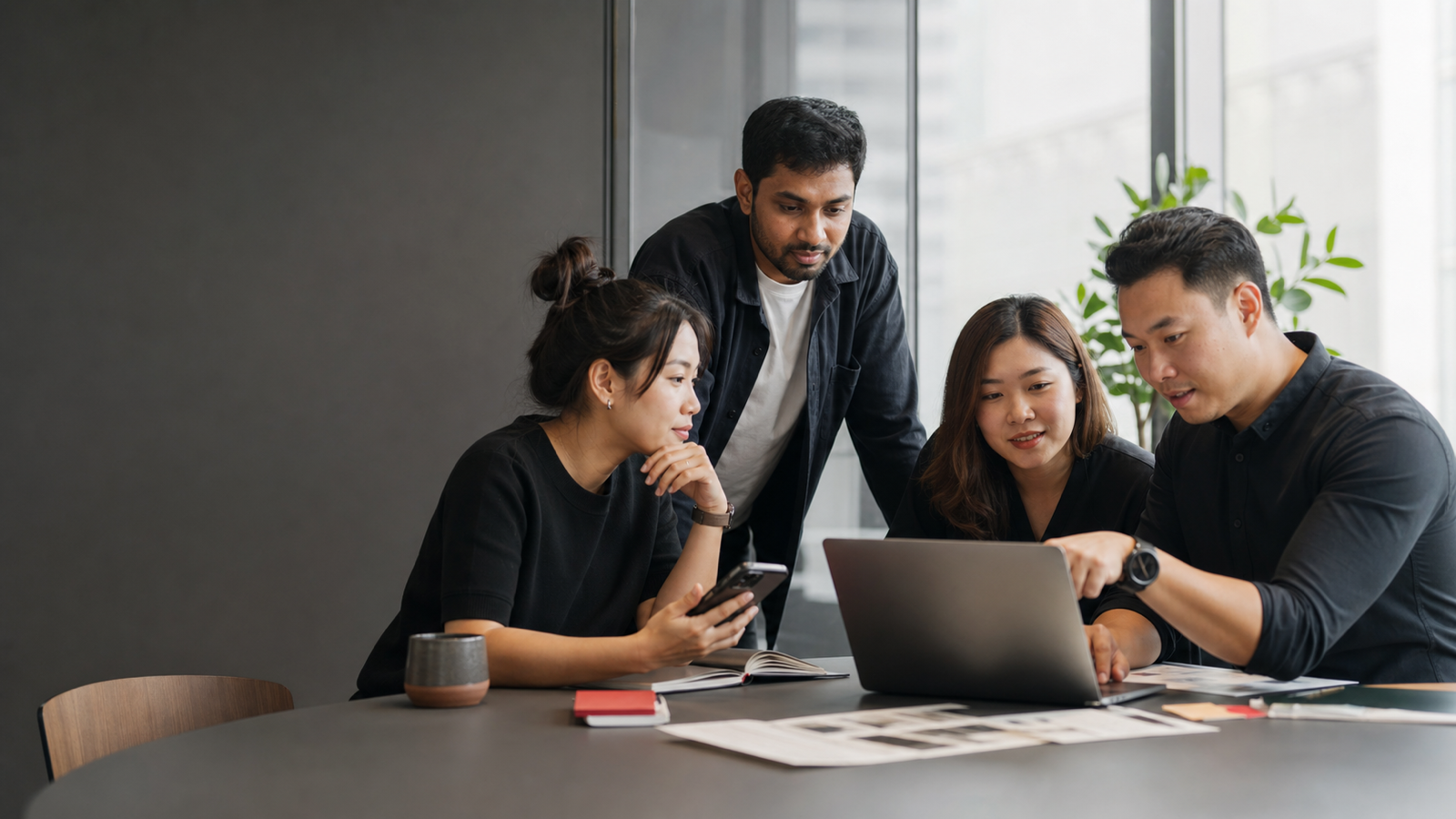 Cross-functional product team reviewing a mobile merchant workflow